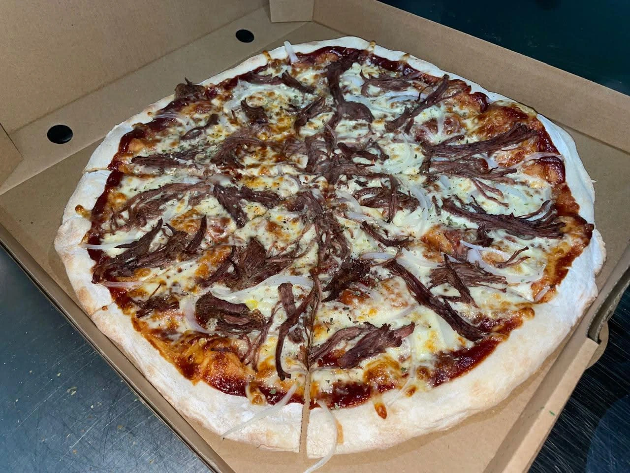 Fotografía de la pizza A la Barbacoa